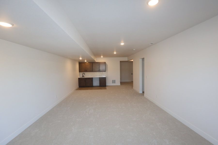 Spacious, unfurnished interior of a new home in Revel Crossing at Wolf Ranch - The Panorama Collection, Colorado Springs (Image 9). Spacious, unfurnished interior of a new home in Revel Crossing at Wolf Ranch - The Panorama Collection, Colorado Springs (Image 9).