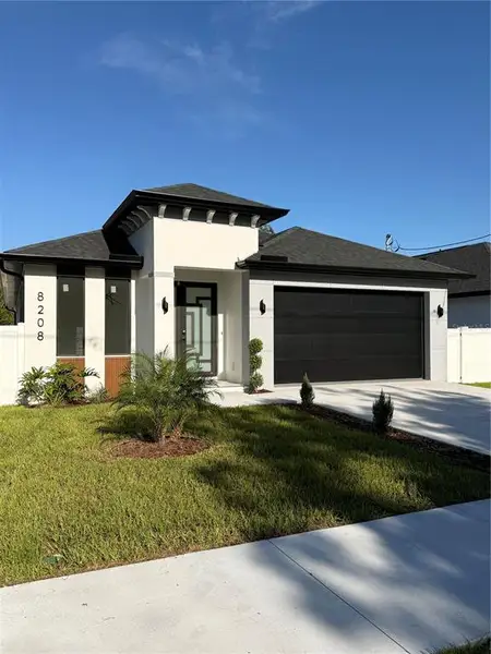 Front exterior of a new home in , Tampa, FL, highlighting curb appeal (Image 21).
