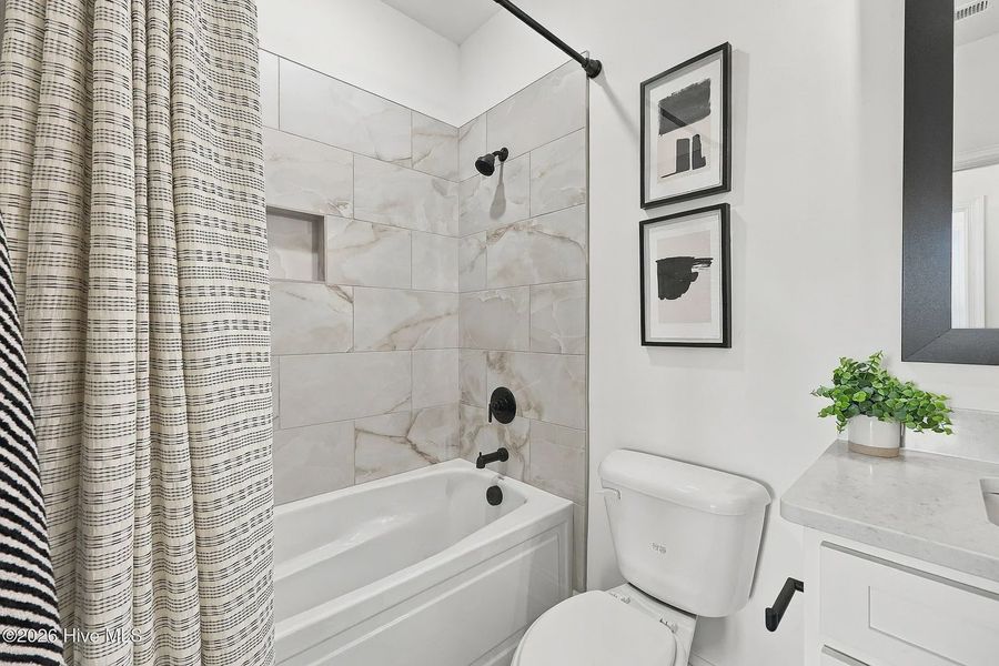 Furnished interior view inside a new home in Dixon Grove, Grimesland (Image 12).