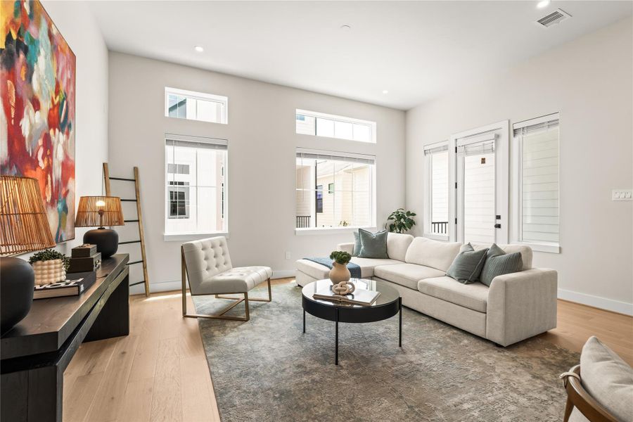 Another angle shows the living room’s usable width, with enough separation from the dining area to comfortably define both spaces.