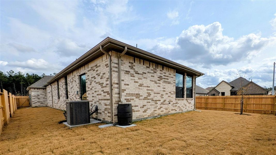 Exterior details and patio area of a home in Artavia, Conroe (Image 20).