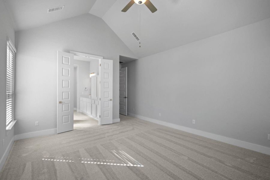 Primary Bedroom with elevated ceiling