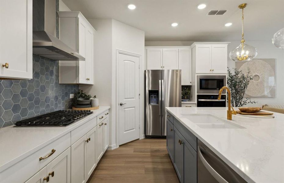 Kitchen featuring a large island ideal for informal dining and gatherings *Model representation