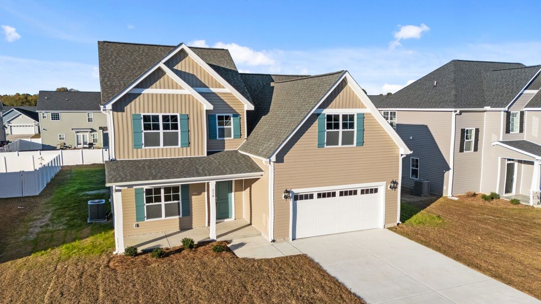 Front exterior of a new home in Arbor Hills South II, Greenville, NC, highlighting curb appeal (Image 22).