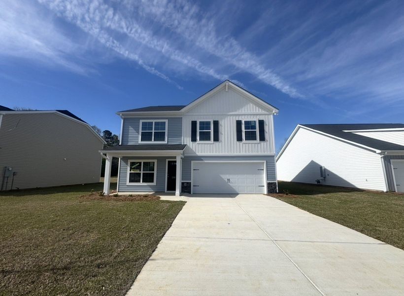 Front exterior of a new home in Crystal Downs, Sumter, SC, highlighting curb appeal (Image 2). Front exterior of a new home in Crystal Downs, Sumter, SC, highlighting curb appeal (Image 2).