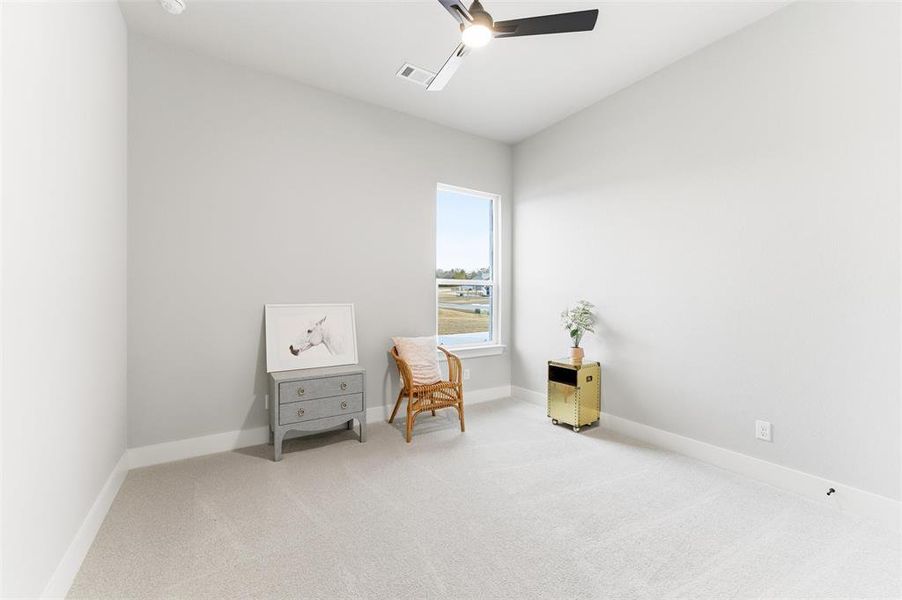Sitting room with carpet floors and ceiling fan