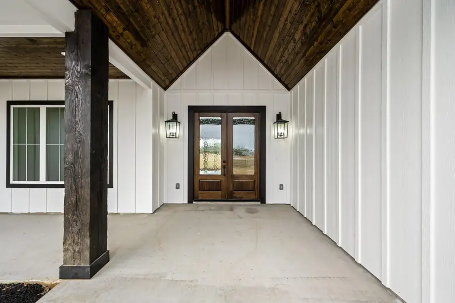 Exterior details and patio area of a home in , New Waverly (Image 4).