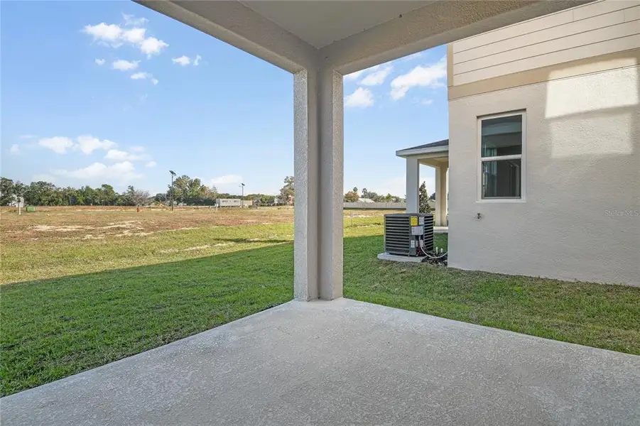 Exterior details and patio area of a home in Seasons at Aurora Oaks, Ocala (Image 4).