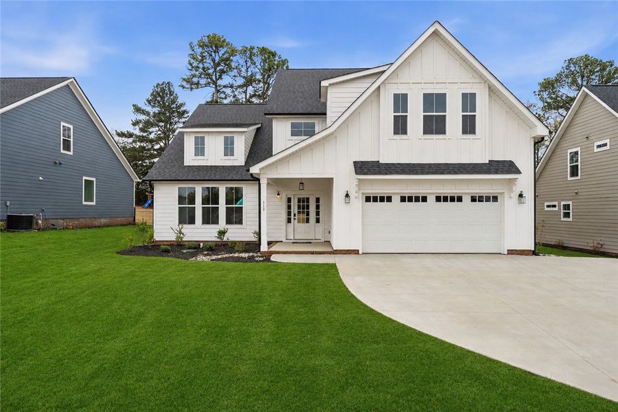 A new construction home with crisp white siding an A new construction home with crisp white siding an