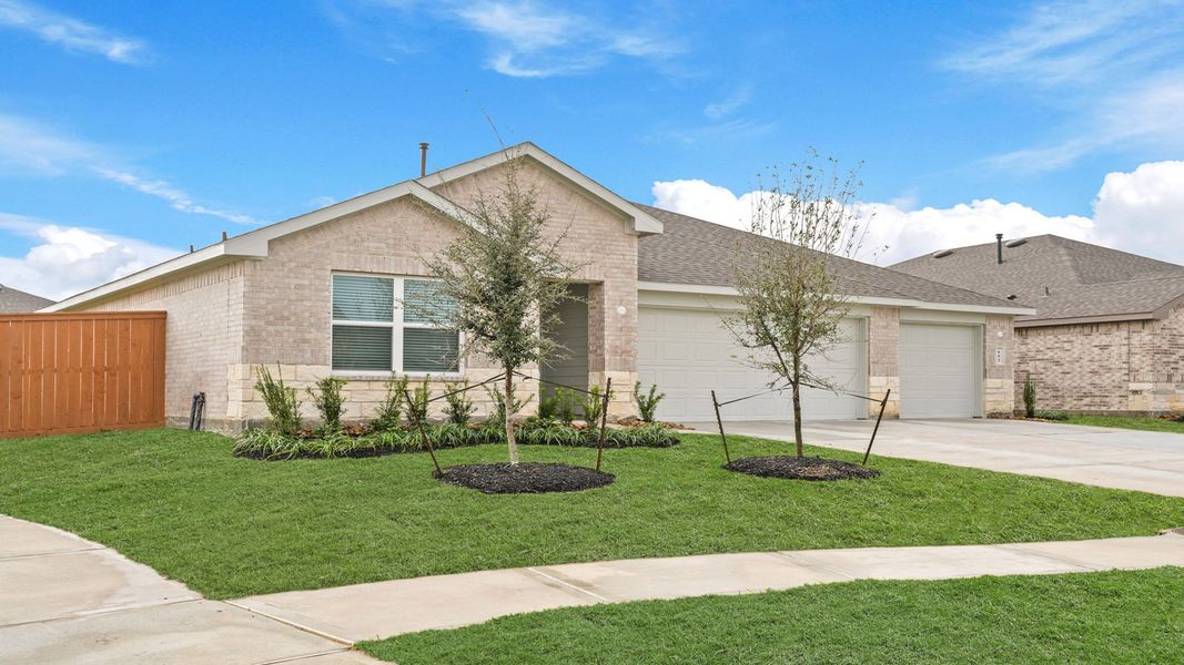Front exterior of a new home in River Ranch Meadows, Dayton, TX, highlighting curb appeal (Image 17).