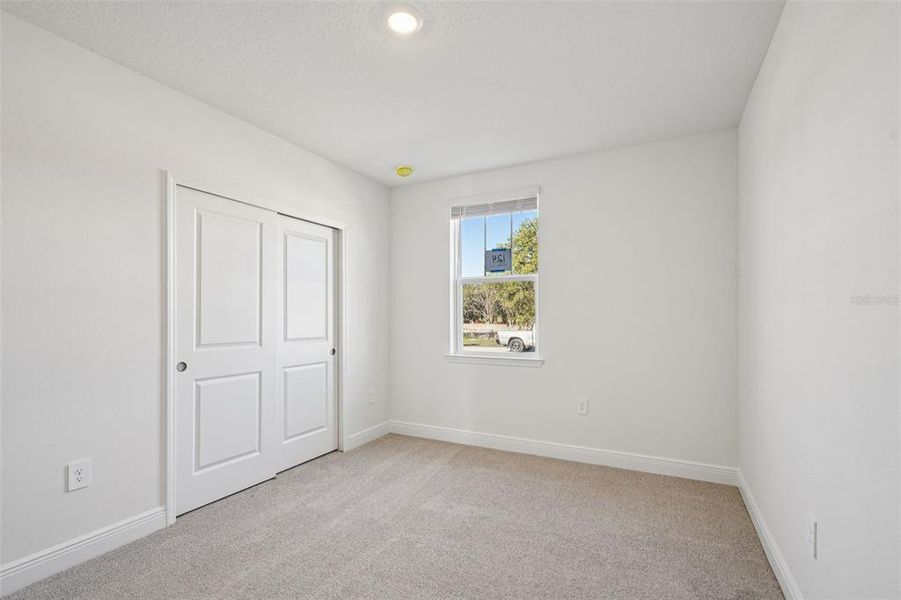 Spacious, unfurnished interior of a new home in The Reserve at Hammock Oaks - Signature Series, Lady Lake (Image 14).