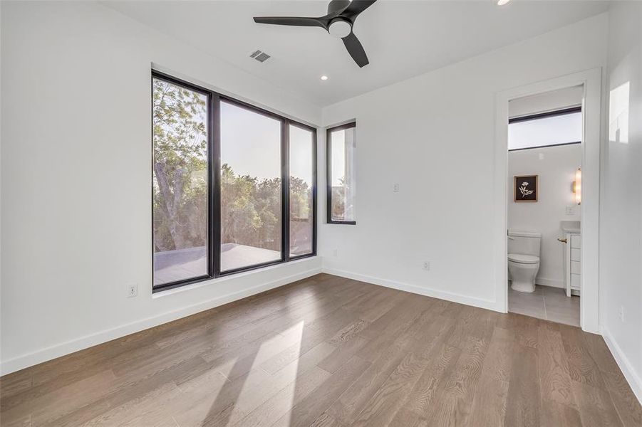 Second upstairs guest bedroom with views to front of the home.