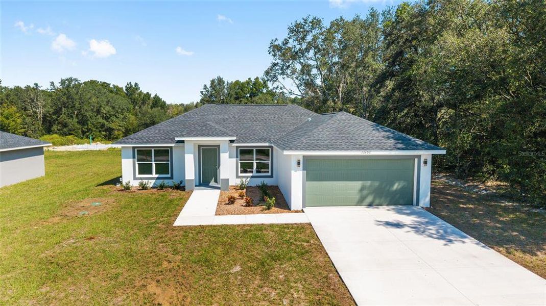 Front exterior of a new home in , Dunnellon, FL, highlighting curb appeal (Image 11).