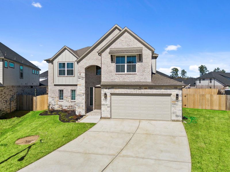Front exterior of a new home in Barton Creek Ranch, Conroe, TX, highlighting curb appeal (Image 16).