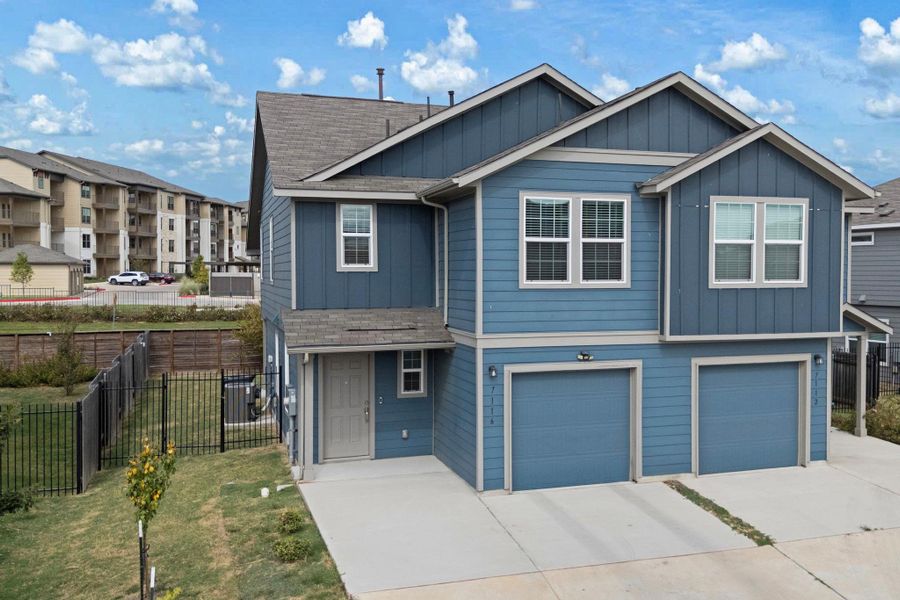 Front exterior of a new home in Stoney Ridge, Del Valle, TX, highlighting curb appeal (Image 1). Front exterior of a new home in Stoney Ridge, Del Valle, TX, highlighting curb appeal (Image 1).