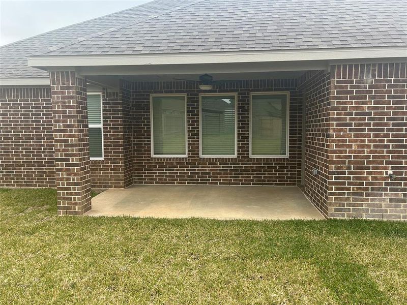 Enjoy outdoor living year-round with this charming covered patio, perfect for relaxing or entertaining!