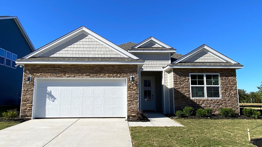 Front exterior of a new home in Livingston Woods, Irmo, SC, highlighting curb appeal (Image 1).
