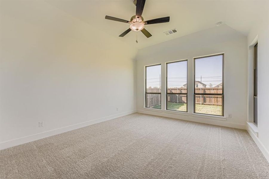 Spare room with light carpet and ceiling fan Spare room with light carpet and ceiling fan