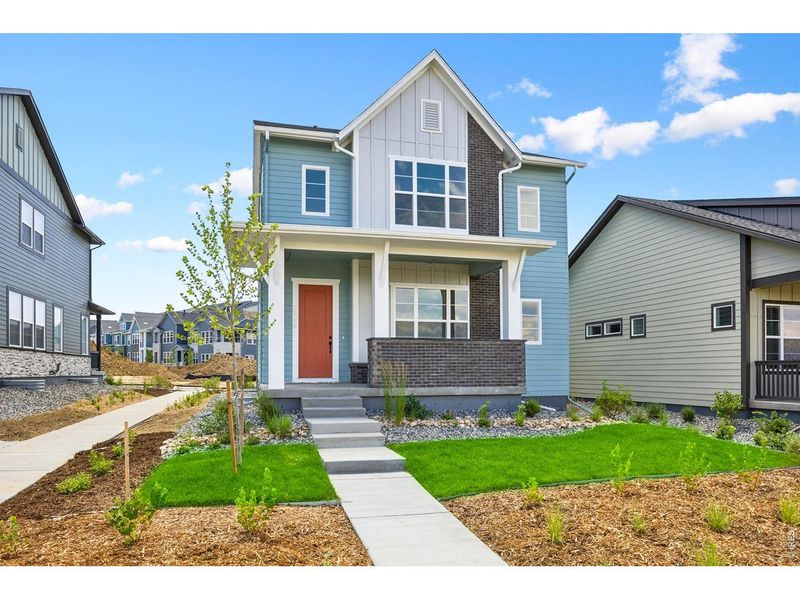 Front exterior of a new home in Kinston Cottage, Loveland, CO, highlighting curb appeal (Image 23). Front exterior of a new home in Kinston Cottage, Loveland, CO, highlighting curb appeal (Image 23).
