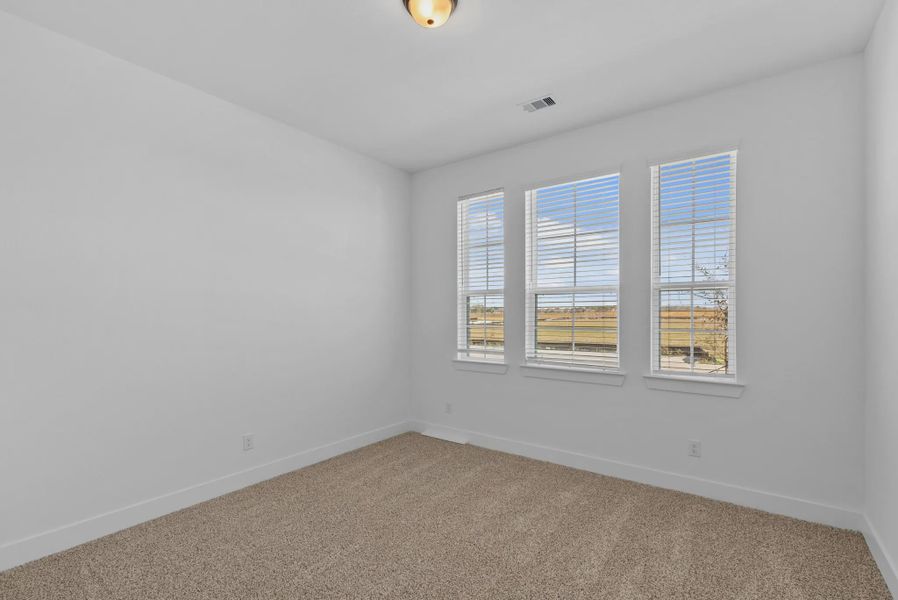 Representative unfurnished interior of a home built from the Nicklaus by Chesmar Homes in Riceland Alley Loads, Mont Belvieu (Image 56).