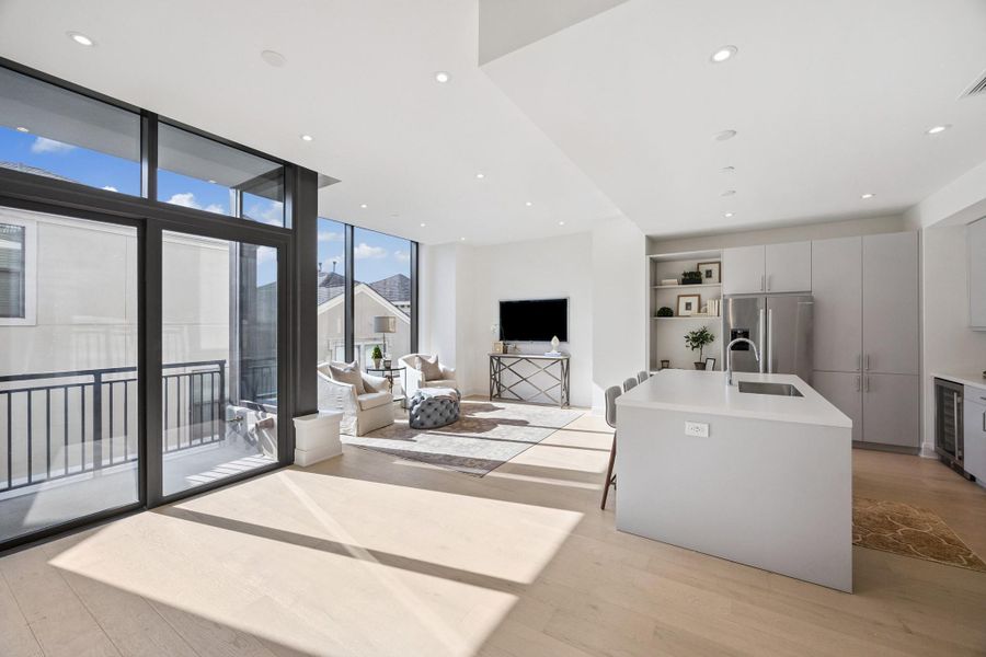 Kitchen is complete with built-in home hub area and quartz countertops. All residences come with Bosch SS appliances, full-sized W/Ds and Italian cabinetry. Kitchen is complete with built-in home hub area and quartz countertops. All residences come with Bosch SS appliances, full-sized W/Ds and Italian cabinetry.