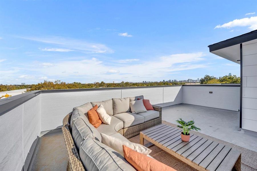 View of patio with an outdoor living space and a balcony