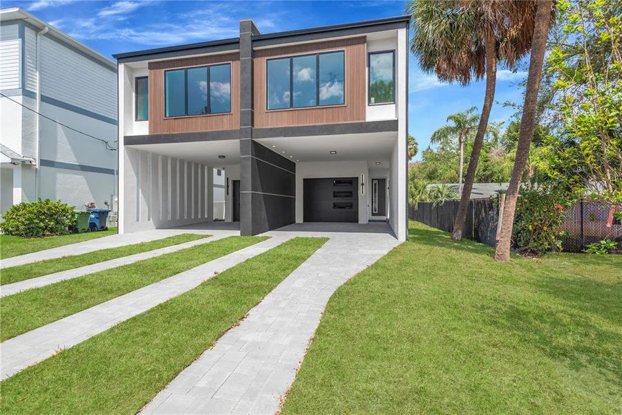 Front exterior of a new home in , Tampa, FL, highlighting curb appeal (Image 2). Front exterior of a new home in , Tampa, FL, highlighting curb appeal (Image 2).
