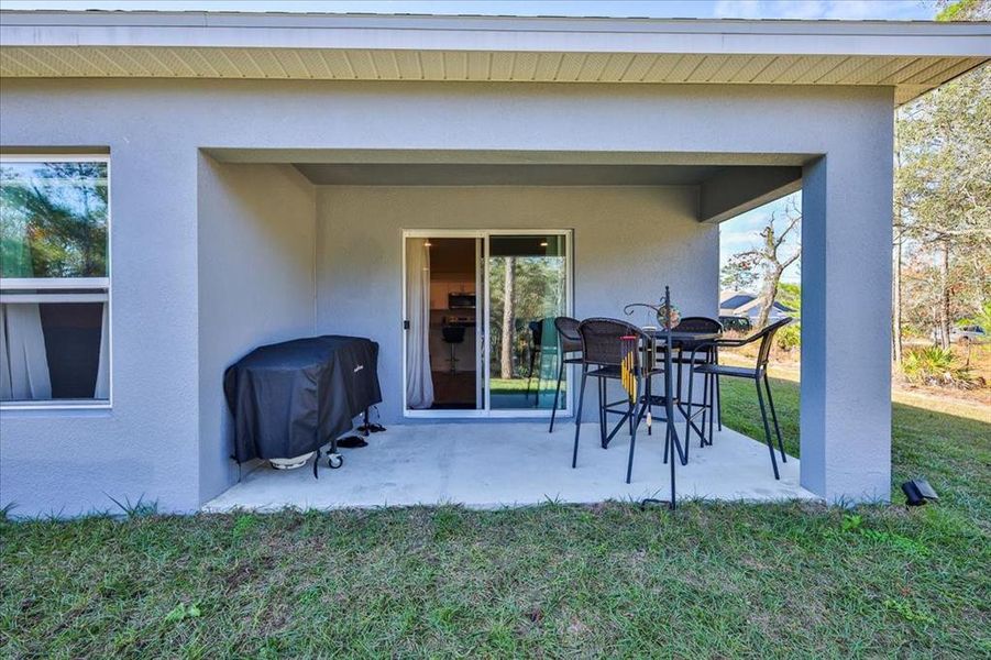 Exterior details and patio area of a home in Royal Highlands, Brooksville (Image 30).