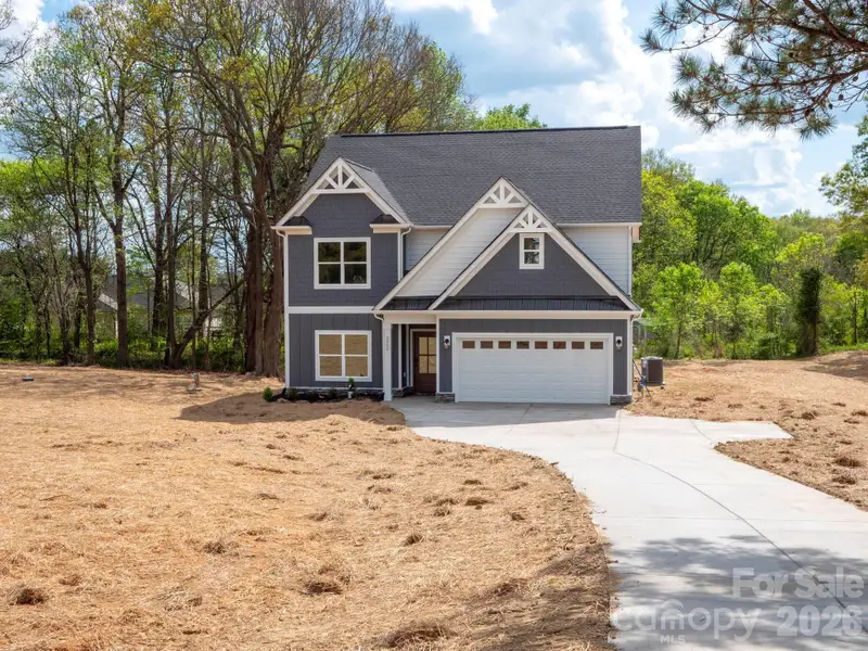 Front exterior of a new home in , Monroe, NC, highlighting curb appeal (Image 1). Front exterior of a new home in , Monroe, NC, highlighting curb appeal (Image 1).