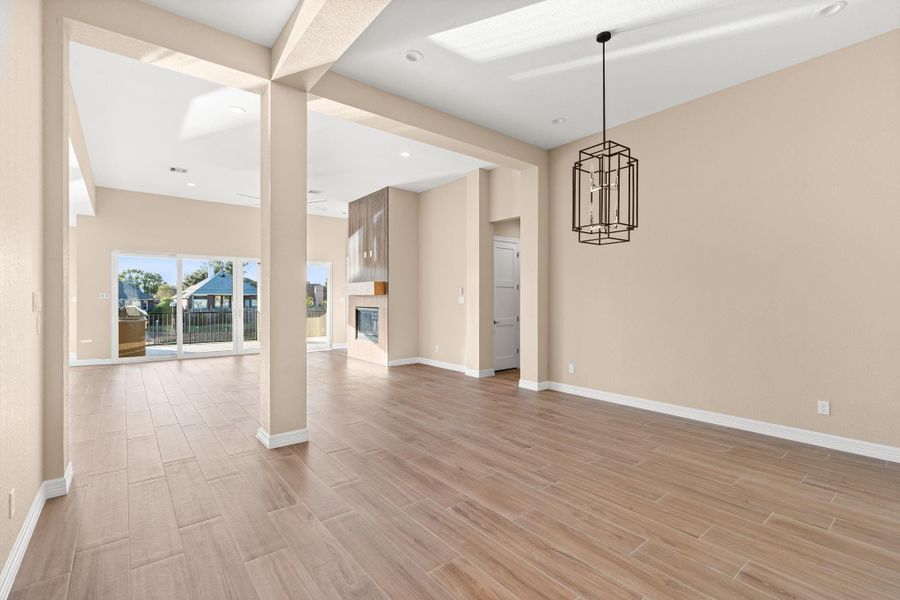 Open concept with dining room and living room and views overlooking the back patio.