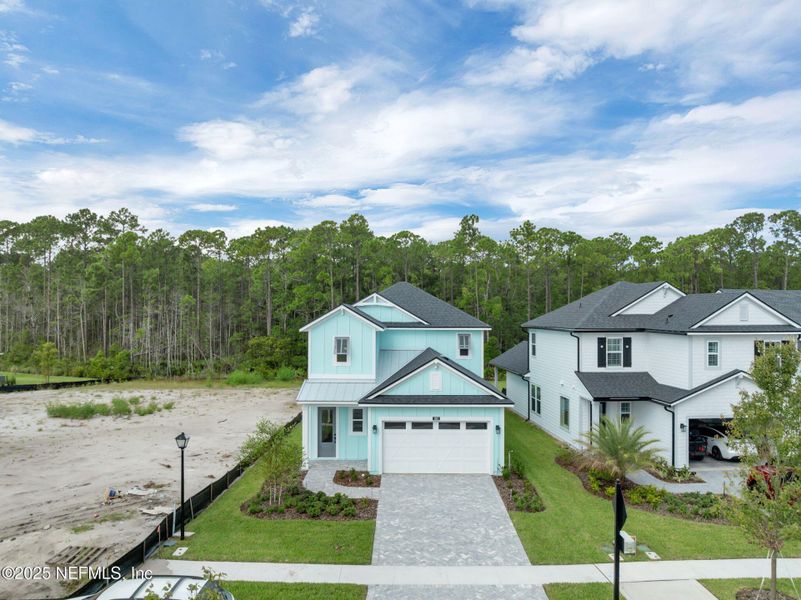Front exterior of a new home in Reflections at Nocatee, Ponte Vedra, FL, highlighting curb appeal (Image 24).