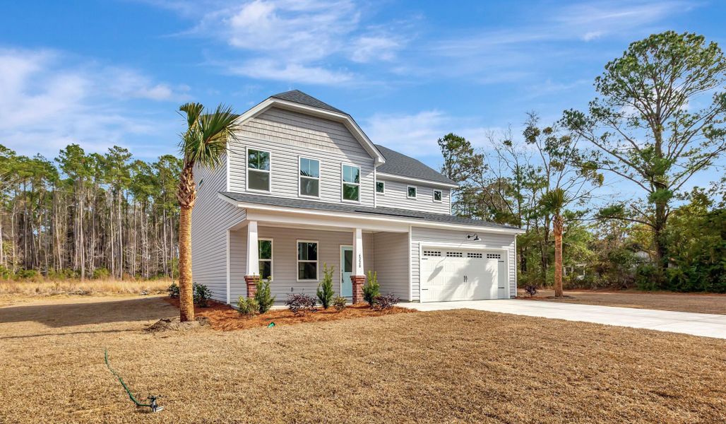 Front exterior of a new home in , Awendaw, SC, highlighting curb appeal (Image 1). Front exterior of a new home in , Awendaw, SC, highlighting curb appeal (Image 1).