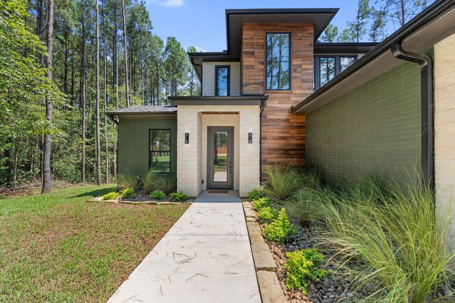 Front exterior of a new home in , Livingston, TX, highlighting curb appeal (Image 26).