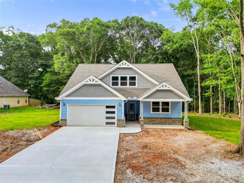 Front exterior of a new home in , Commerce, GA, highlighting curb appeal (Image 26).