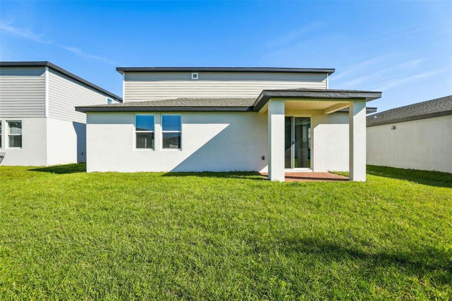 Exterior details and patio area of a home in The Meadow at Crossprairie, St. Cloud (Image 29).