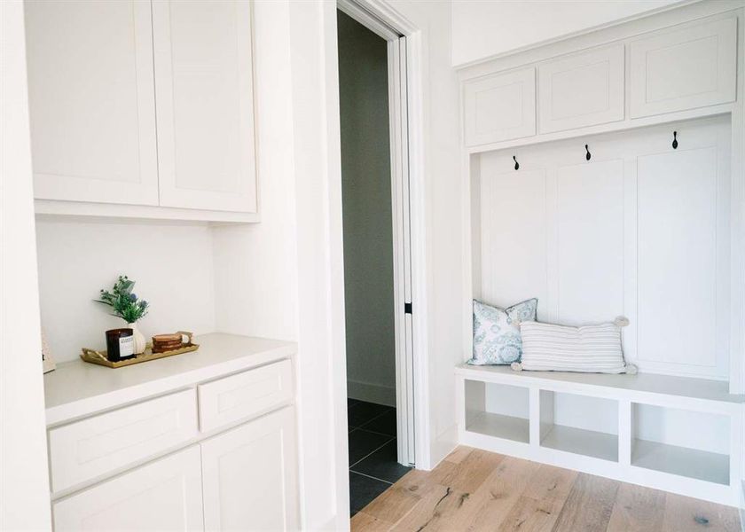 Mudroom with light tile flooring