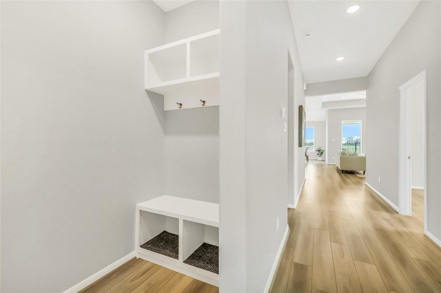 Functional drop zone and mudroom area located conveniently off the garage entry.