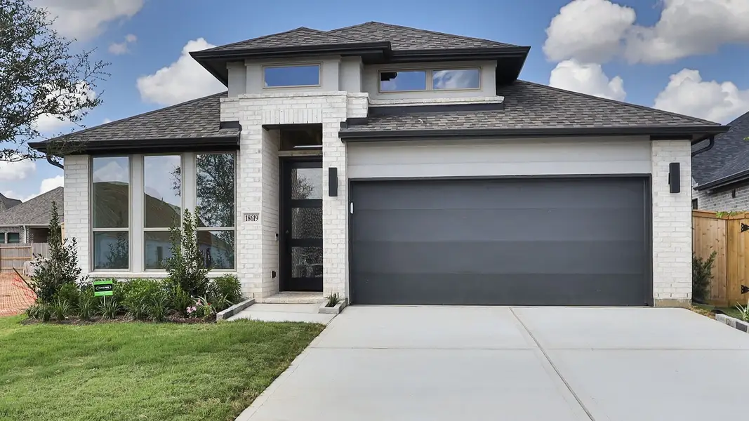 Front exterior of a new home in Everly, Hockley, TX, highlighting curb appeal (Image 1). Front exterior of a new home in Everly, Hockley, TX, highlighting curb appeal (Image 1).