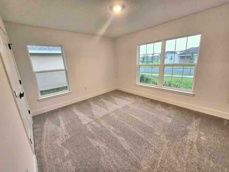 Spacious, unfurnished interior of a new home in Harmony Central, Harmony (Image 13).