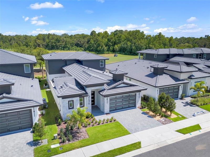 Front exterior of a new home in Hampton Green at Providence, Davenport, FL, highlighting curb appeal (Image 32).