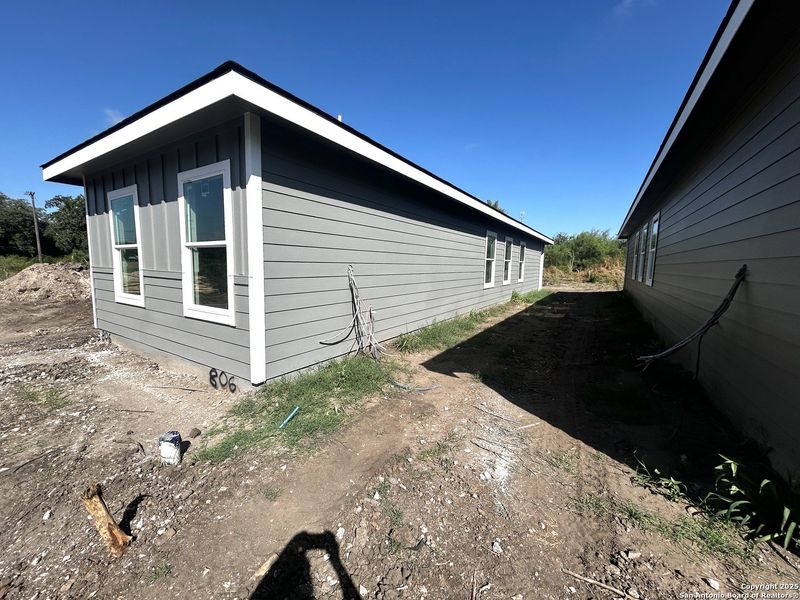 Front exterior of a new home in , Beeville, TX, highlighting curb appeal (Image 4).