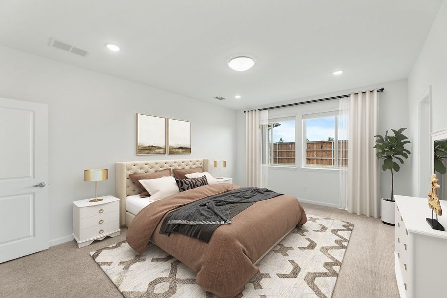 Bedroom with tufted headboard, neutral carpet, patterned area rug, and large window with white drapes