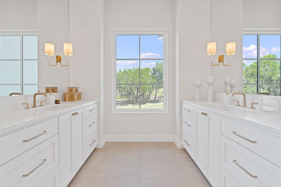 Bathroom featuring two vanities, a wealth of natural light. Bathroom featuring two vanities, a wealth of natural light.