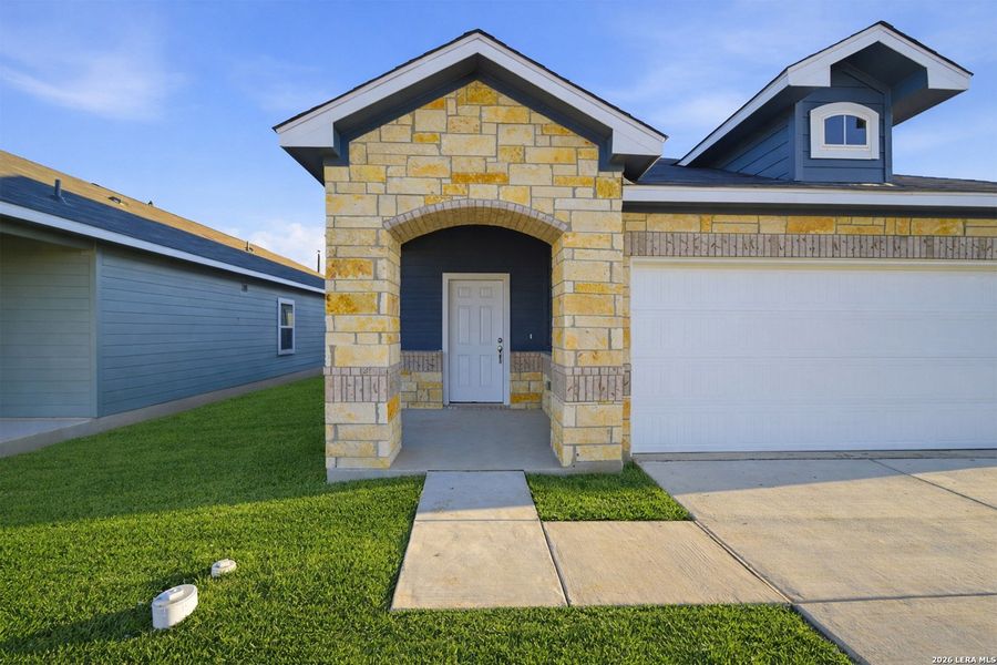 Front exterior of a new home in Garden Grove, San Antonio, TX, highlighting curb appeal (Image 2).