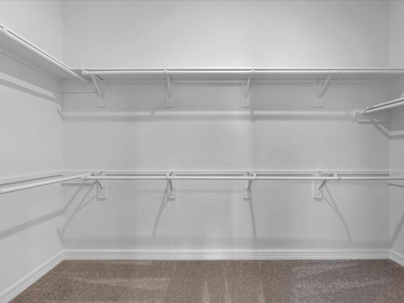 Primary closet. Sample product photo. Actual exterior and interior selections may vary by homesite. Photo may be virtually staged.