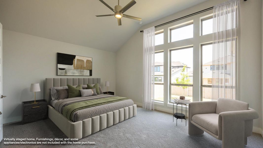 Bedroom with carpet and high vaulted ceiling Bedroom with carpet and high vaulted ceiling