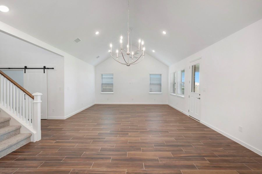 Open living area with vaulted ceilings (*Photo not of actual home and used for illustration purposes only.)