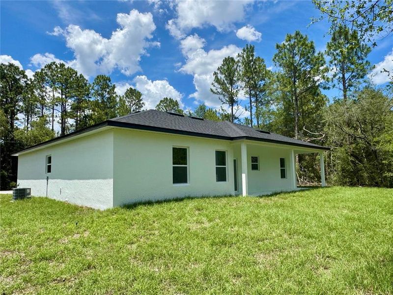 Exterior details and patio area of a home in , Citrus Springs (Image 18).