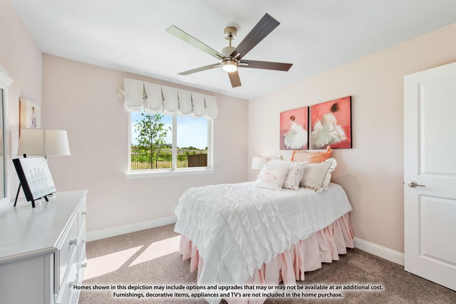 Bedroom with pink walls, ceiling fan, carpet flooring, and a window with backyard views Bedroom with pink walls, ceiling fan, carpet flooring, and a window with backyard views