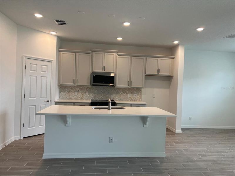 Furnished interior view inside a new home in Trinity Gardens, Deland (Image 9).